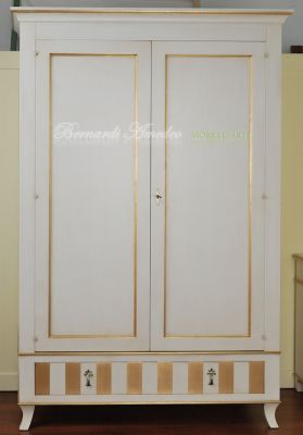 Classic wooden cabinet with white lacquered finish and hand-applied gold leaf